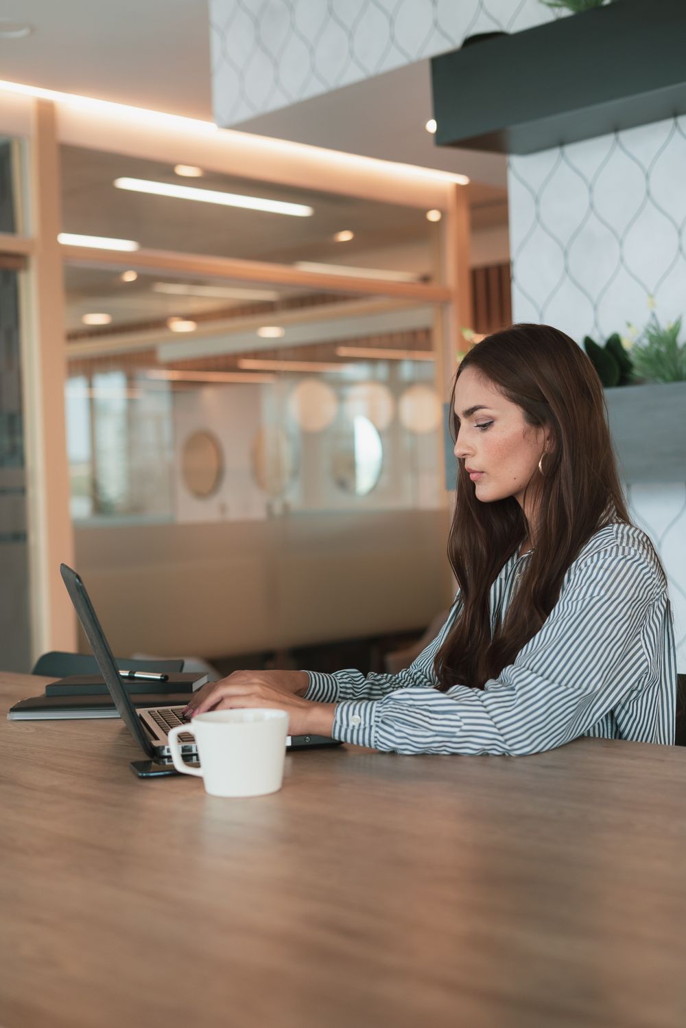 A marketer reviewing new leads at her desk